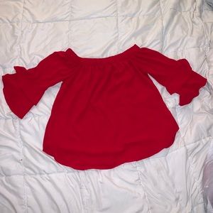 Red over the shoulder blouse with ruffled sleeves